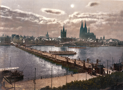 Cologne, Germany, 1890-1905. Moonlight view of the city looking across the river Rhine with the Cathedral on the right.