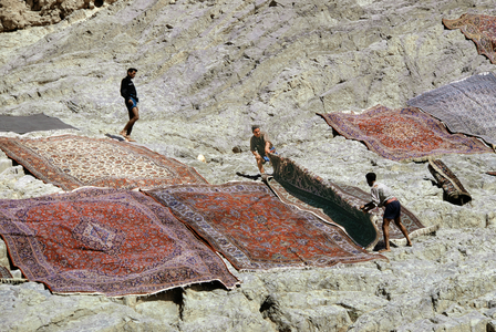 Persian carpets dry on rocks, Tehran, c.1970s (photo)