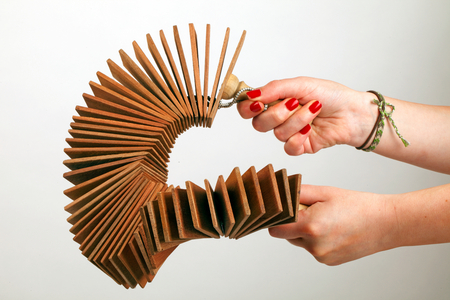 Kokorico or Binsasara, collection of wooden slats with handles at either end, Being played