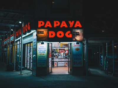 Papaya Dog sign at night, in the West Village, Manhattan, New York, USA (photo)