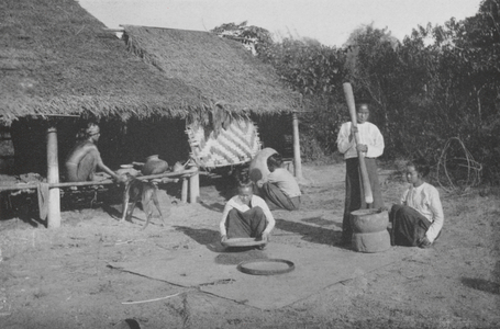 Burma: Burmese Villagers Pounding Rice (b/w photo)