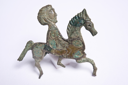 Bronze brooch in the shape of a horse and rider with inlaid enamel (copper alloy enamel)