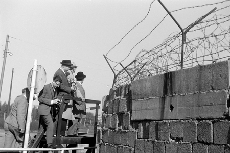 Tourists look from a vantage point on the corner of Potsdamer Platz and Potsdamer Straße across the wall from the western part to the eastern part of Berlin, Germany 1962