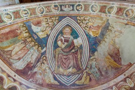 Clessing Christ in majesty within the almond and holding the book with the words "pacem meam do vobis" in his left hand, apse (fresco)