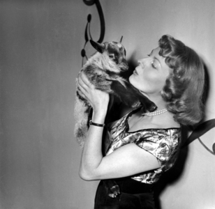 French Actress Junie Astor at Opening of A Movie Theater ("Le Bambi") in Paris, March 18, 1949 With A Fawn Given By Friends) (b/w photo)