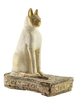 Bastet statue or coffin for a cat mummy, late period, 664-332 BC (wood & textile coated with a thin layer of white plaster, the face is gilded; the eyes are inlaid)