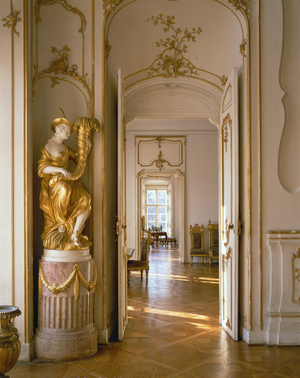 Statue with cornucopia and enfilade of rooms, Eszterhaza Palace, Fertoed, Hungary (photo)