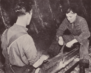 Filing the table of a rail joined by the thermit fusion welding process (b/w photo)