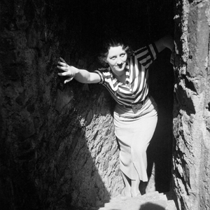 A woman coming through a floor at the sightseeing tour at Auerbach castle in the Odenwald region, Germany 1930s (b/w photo)