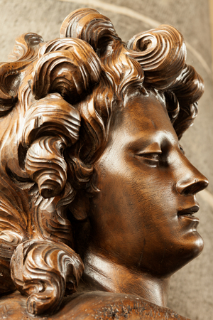 Parish church (Sint-Pieterskerk). Interior. Statue of an angel. Varnished wood.