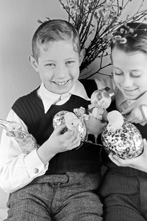 Two boys at a table with easter decoration, Germany 1930s (b/w photo)