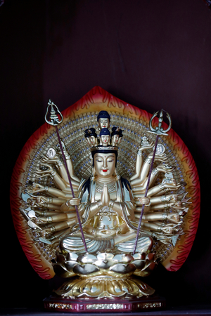 Thousand-armed Avalokitesvara, the Bodhisattva of Compassion.  Vietnam.(sculpture)