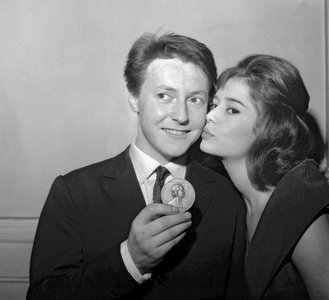 Roger Dumas congratulated by his fiancee Marie Jose Nat after he received a prize ("Prix Suzanne Bianchetti"), Paris, December 11, 1959