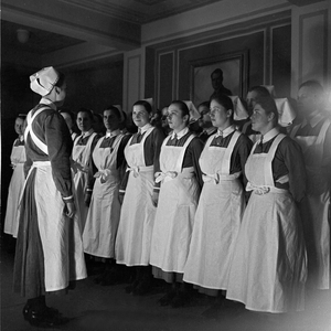 Nurses mustered for the roll call at the rest centre for mothers at Dittersbach castle near Dresden, Germany 1930s (b/w photo)