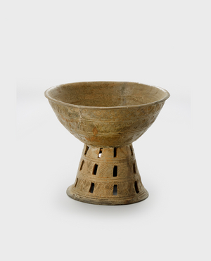 Stand, c.500 (Stoneware with accidental ash glaze,
openwork, and incised decoration)