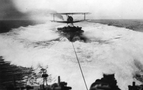 Lieutenant Culley takes off in a Sopwith Camel from a lighter towed by a destroyer (b/w photo)