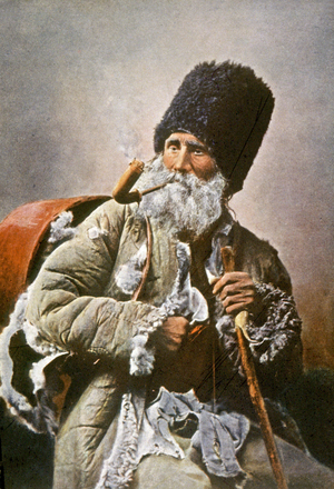 Gypsy vendor of dishes, c.1910 (postcard)