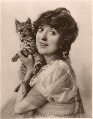 Actress Mabel Normand, Publicity Portrait with Cat, 1910 (b/w photo)