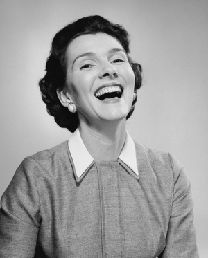 Close-up of a mid adult woman laughing