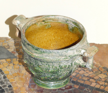 Cup with an unusual green-glaze on the outside and yellow-brown glaze inside