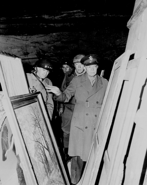 General Dwight Eisenhower viewing confiscated art recovered from the Nazi's after the end of World War II, 1945. Eisenhower, 1890 - 1969 General in the United States Army and the 34th President of the United States, from 1953 until 1961. During World War