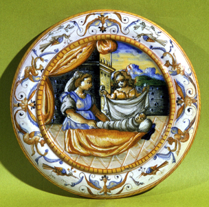 Women changing a baby, 16th century (earthenware)