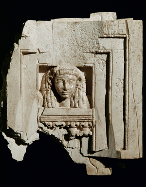 Woman's head in a window (ivory)