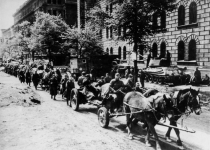 Red Army occupying Berlin after the battle of Berlin (april 16 - may 2, 1945) : horse-drawn russian artillery and supplies in Berlin street