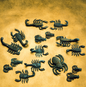 Moche gilded copper arthropod arachnid decorations including spiders and scorpions, 1989 (photo)