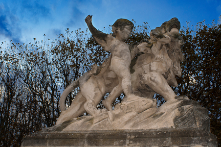Child with lion statue at the entrance to the gardens of Place Royale du Peyrou in Montpellier France, 

The Promenade du Peyrou also known as the Place Royale du Peyrou, is an esplanade located to the west of the Écusson district, This ensemble, classified as a historic monument, represents a conjunction of five works : the promenade and its terraces allowing you to contemplate the Cévennes and the Pyrenees which were built in 1689, the "Porte du Peyrou" or the Arc de Triomphe with its bridge and access ramps, built in 1691, the equestrian statue of Louis XIV built in 1718, the Saint-Clément aqueduct and its reservoir built from 1753, the water tower whose project was retained in 1766, the children's statues and lion of Injalbert and the entrance gates in 1832, 2020 (photo)