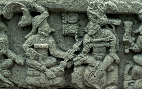 Pre-Columbian Art. Maya. Archaeological Site of Copa?n. Altar Q. West side.  Relief depicting Yax Pasah, the last ruler of Copan, receiving the torch from the founder of the dynasty, Yax Kuk Mo.