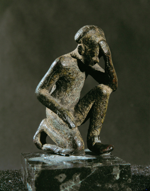 Figurine of a man, kneeling and praying. 900-400 BCE Bronze, …
