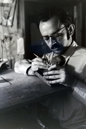 Hermann Diehl, one of the founders and the designer of the popular hedgehog character Meckie in the puppet atelier on the set of the animated children´s movie The Race between the Rabbit and the hedgehog, Germany 1930s (b/w photo)