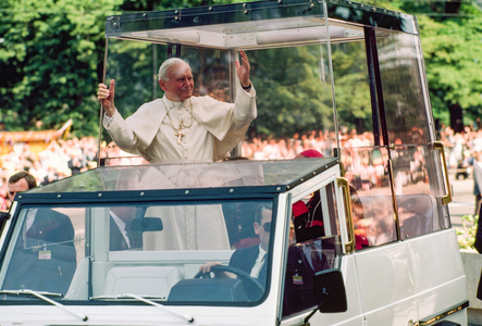 Pope John Paul II rides in his bulletproof vehicle through Warsaw. Warsaw, Pol,., 1980s (photo)