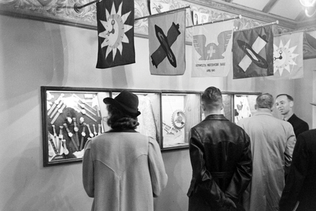 Visitors at the booth of Switzerland at Leipzig trade show, Germany 1940s (b/w photo)