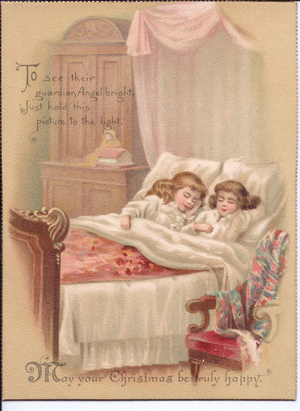 A Victorian hold-to-light Christmas Card of two children in bed asleep. When the card is held in front of a light source a nativity scene appears, circa 1890 (coloured lithograph)