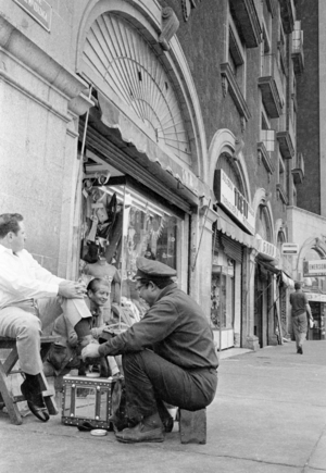 Shoe polisher in Mexico City, 1970 (b/w photo)