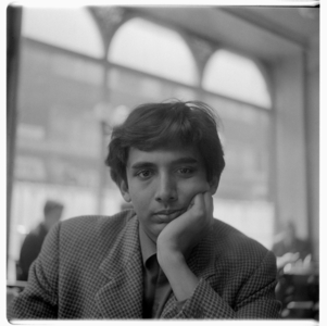 Portrait of poet Dom Moraes (b/w photo)