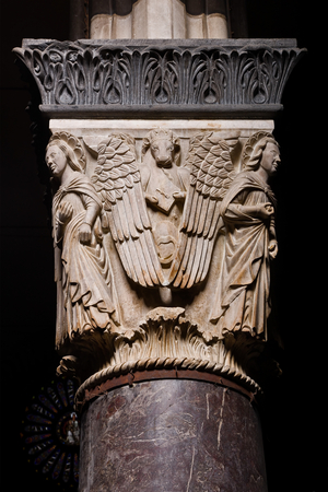 Genoa, Duomo (St Lawrence Cathedral), inside, the nave, left matroneum, lower order: "Capital with the symbols of the Evangelists - Side of St Luke", (1307) by Campionese sculptor known as Master of the Angels of the Cathedral