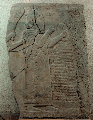Barrekup, King of Aram, worshipping the divine emblem, and an Aramaic inscription describing the construction of the palace (bas-relief)
