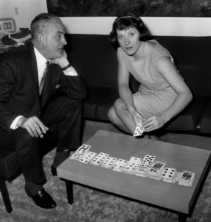 Colette Fox, in the middle of Reussites, in one of the lounges at Orly Airport where she must fly to the United States. She Will Give A Series Of Recitals Accompanied By Her Husband Raymond Legrand's Orchestra, Here A Left. October 24, 1961 (b/w photo)