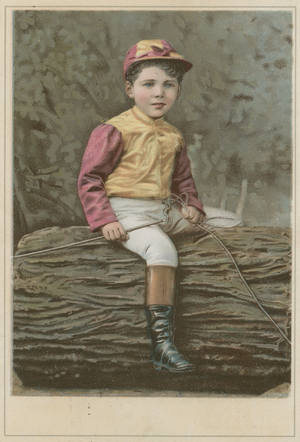 Little boy in jockey clothing sitting on a log (chromolitho)