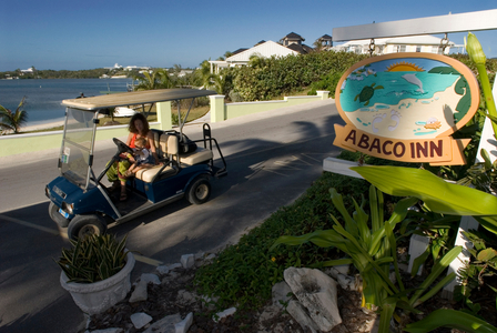 Golf car parked outside the Abaco Inn, Bahamas (photo)