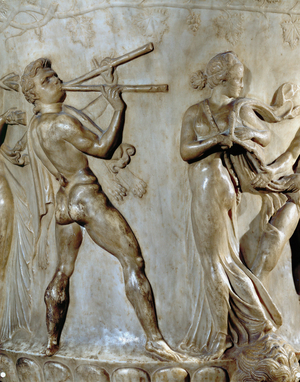 A procession of Bacchus and his followers, a satyr plays the double flute, a Maenad …