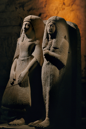 Limestone double statue of a priest named Amenemipet and his wife, New Kingdom, 2002 (photo)