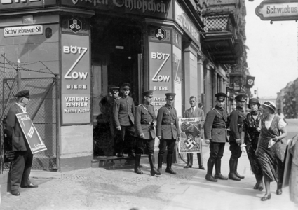 Uniformed persons while leaving a polling station in Berlin (b/w photo)
