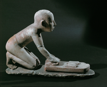 A baker kneading dough …