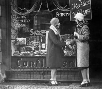 Customers in front of a mom-and-pop store (b/w photo)