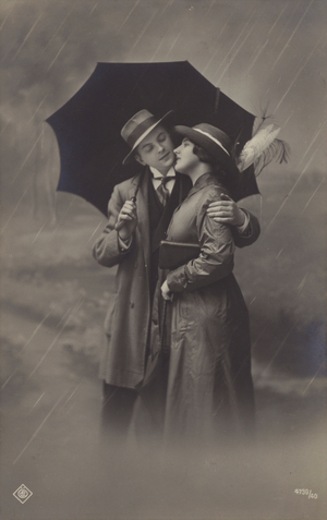 Couple in the rain, under umbrella (b/w photo)