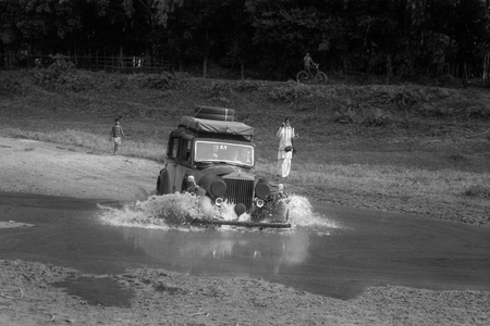 Rolls in river filmed by a neo-Vaishnavite monk, one of 200 plus on Majuli island, one of the largest riverine islands in the world., 2012 (b/w photo)